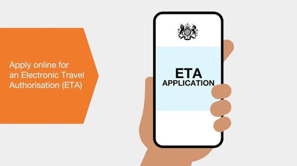 Traveler using a laptop to complete the UK ETA 2025 online application form for entry to the United Kingdom